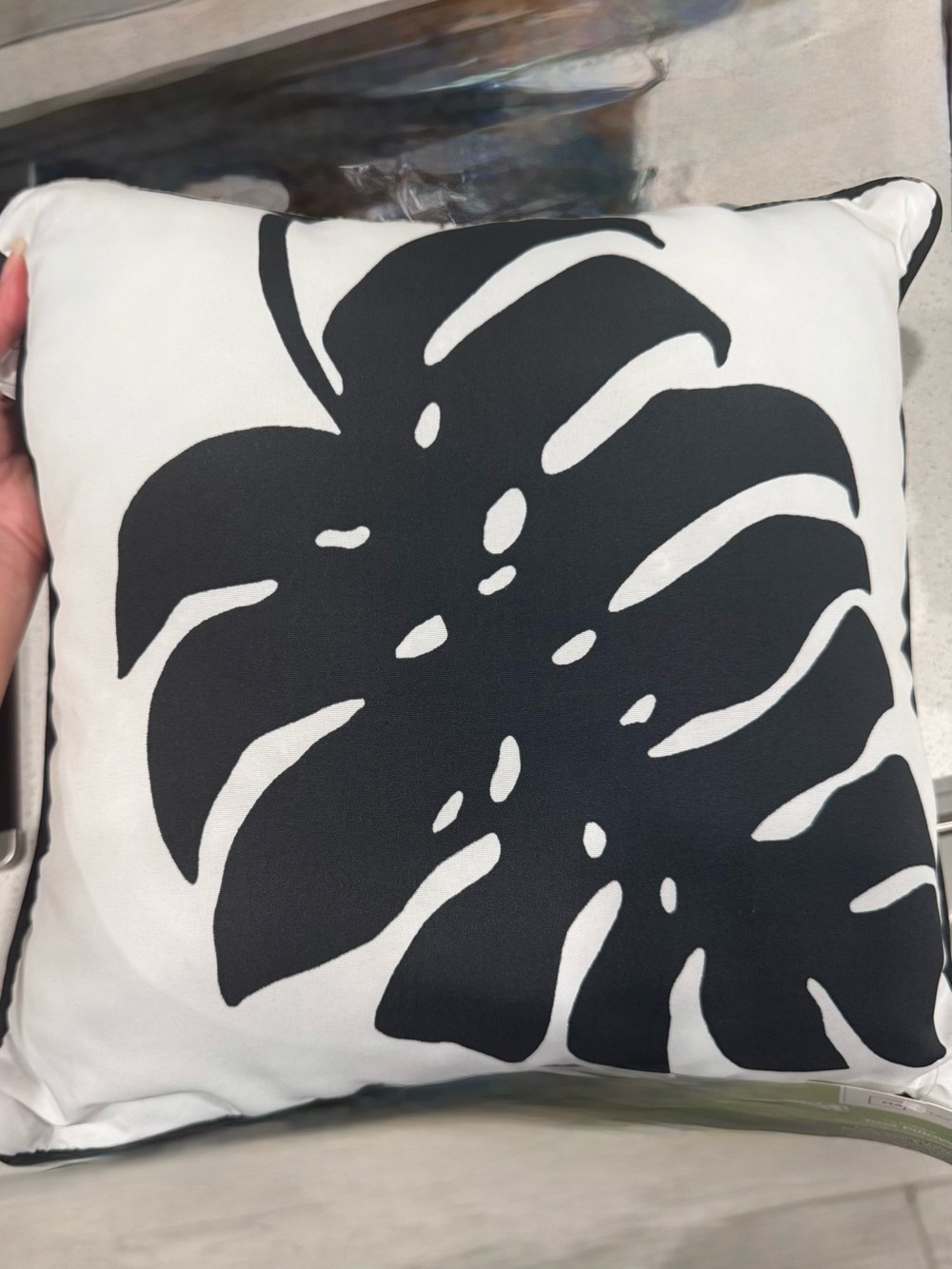 Two Mainstays outdoor toss pillows